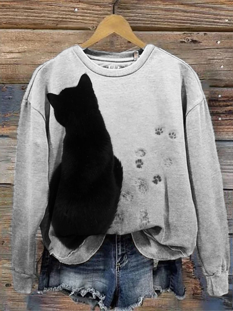 Black Cat & Paw Prints In The Snow Sweatshirt elevenforest