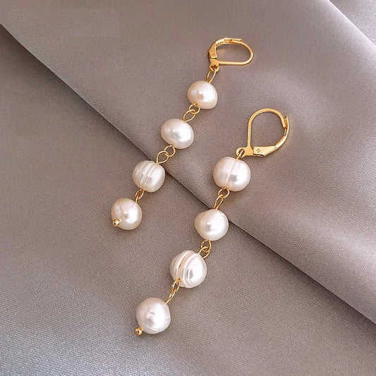 Pearl Dangling Earrings In Gold