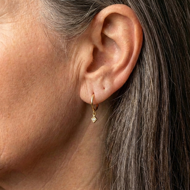 An Elegant Minimalist Gold Drop Huggie Earring Set