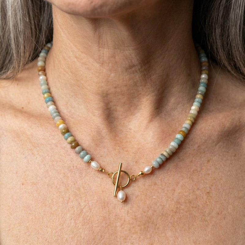 A Golden Necklace With Stones